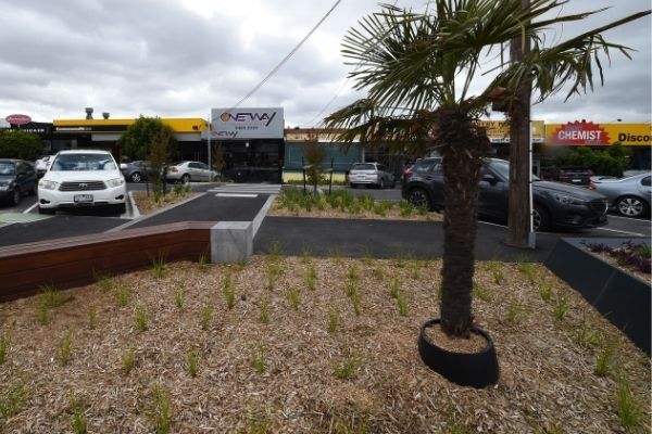 Photo of new streetscape in Lalor featuring new benches, grasses and a palm tree