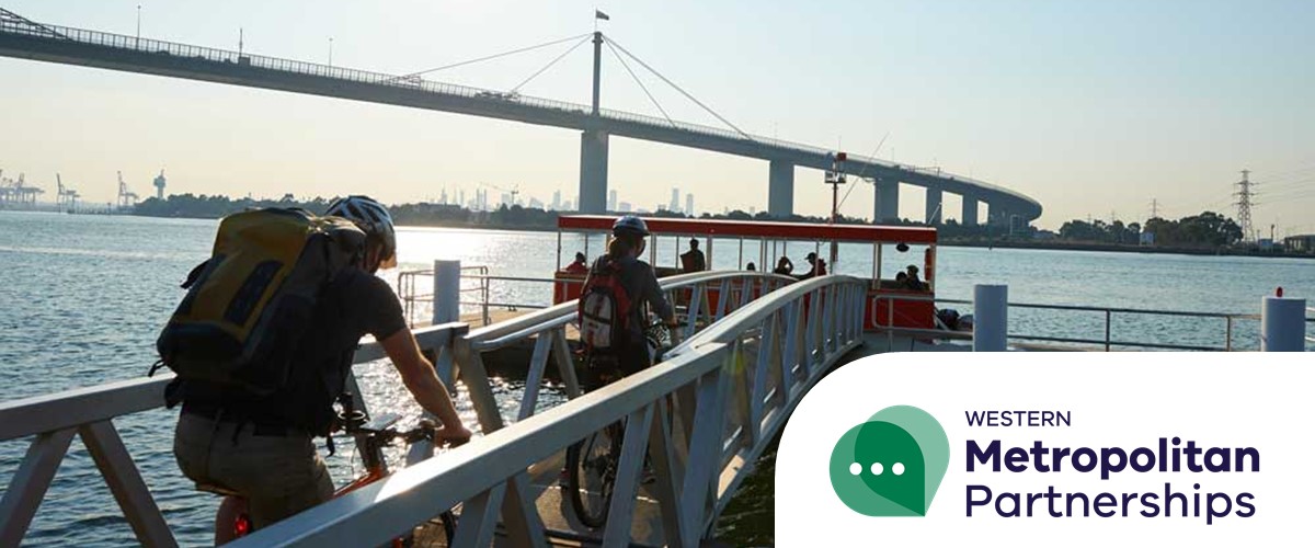 Photo of cyclists riding down a pier in inner West Melbourne